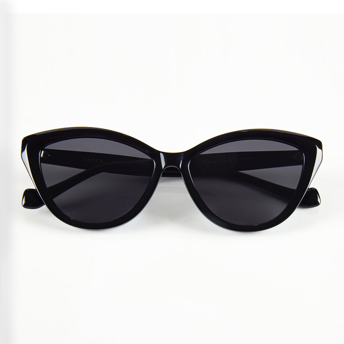 Folded view of Aarka Rosea designer cat-eye sunglasses with black frame and polarized lenses.