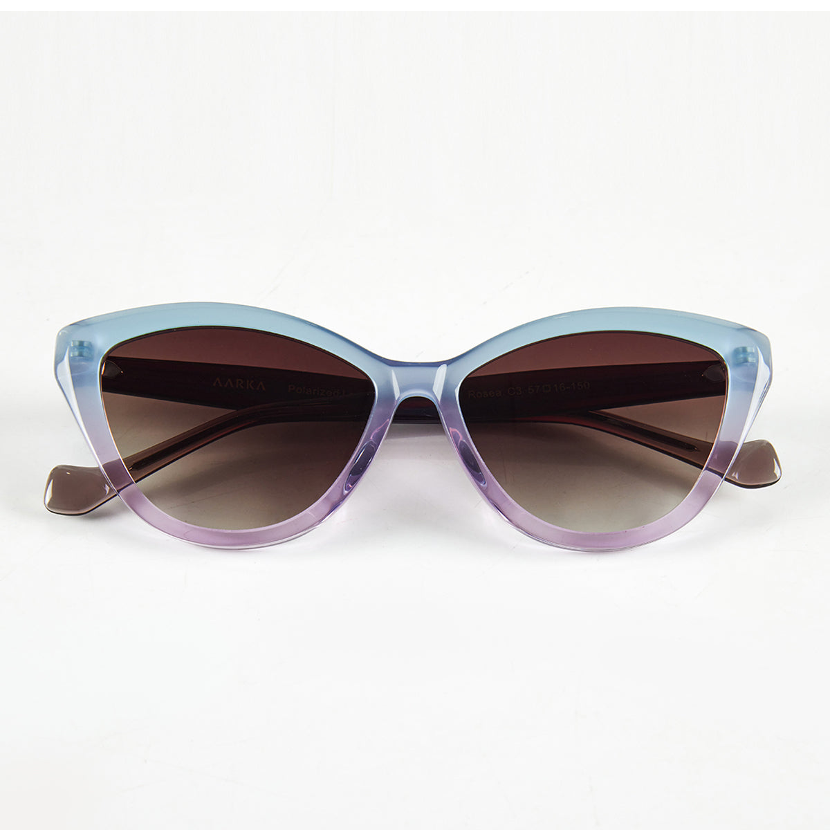 Folded view of Aarka Rosea designer cat-eye sunglasses with sky blue and light purple frame and polarized lenses.