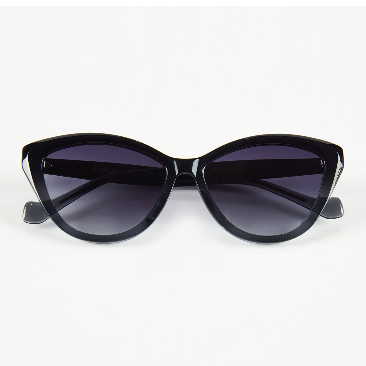 Folded view of Aarka Rosea designer cat-eye sunglasses with black and grey frame and polarized lenses.