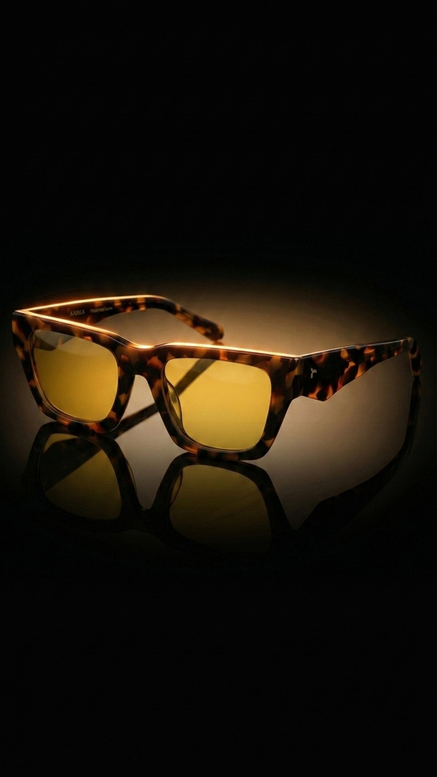 AARKA Camelia C4 polarized square sunglasses featuring a havana yellow full-rim frame with tinted lenses, displayed in a premium studio setting.