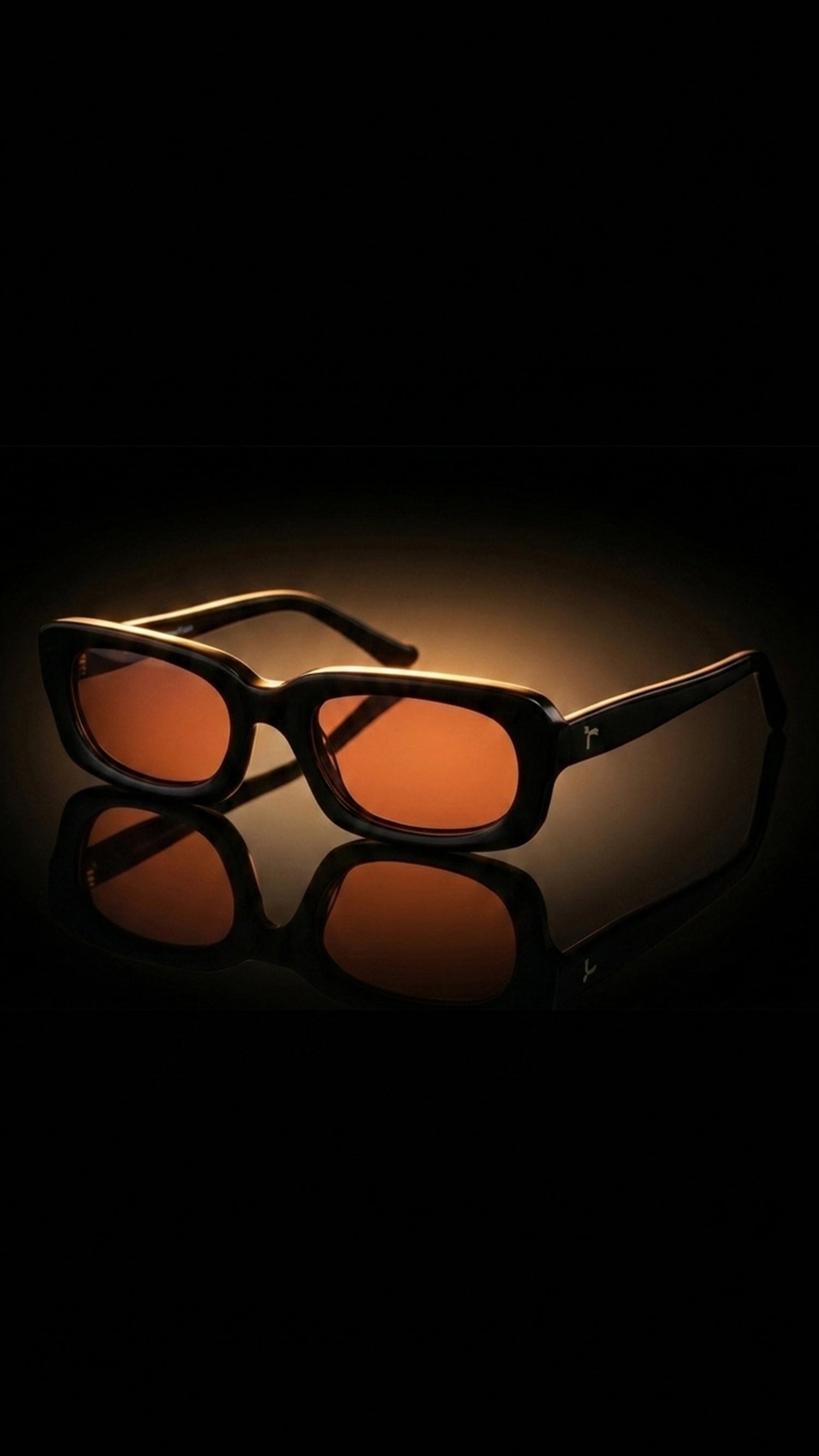 AARKA Elbrus C2 black and orange irregular rectangle polarized sunglasses.