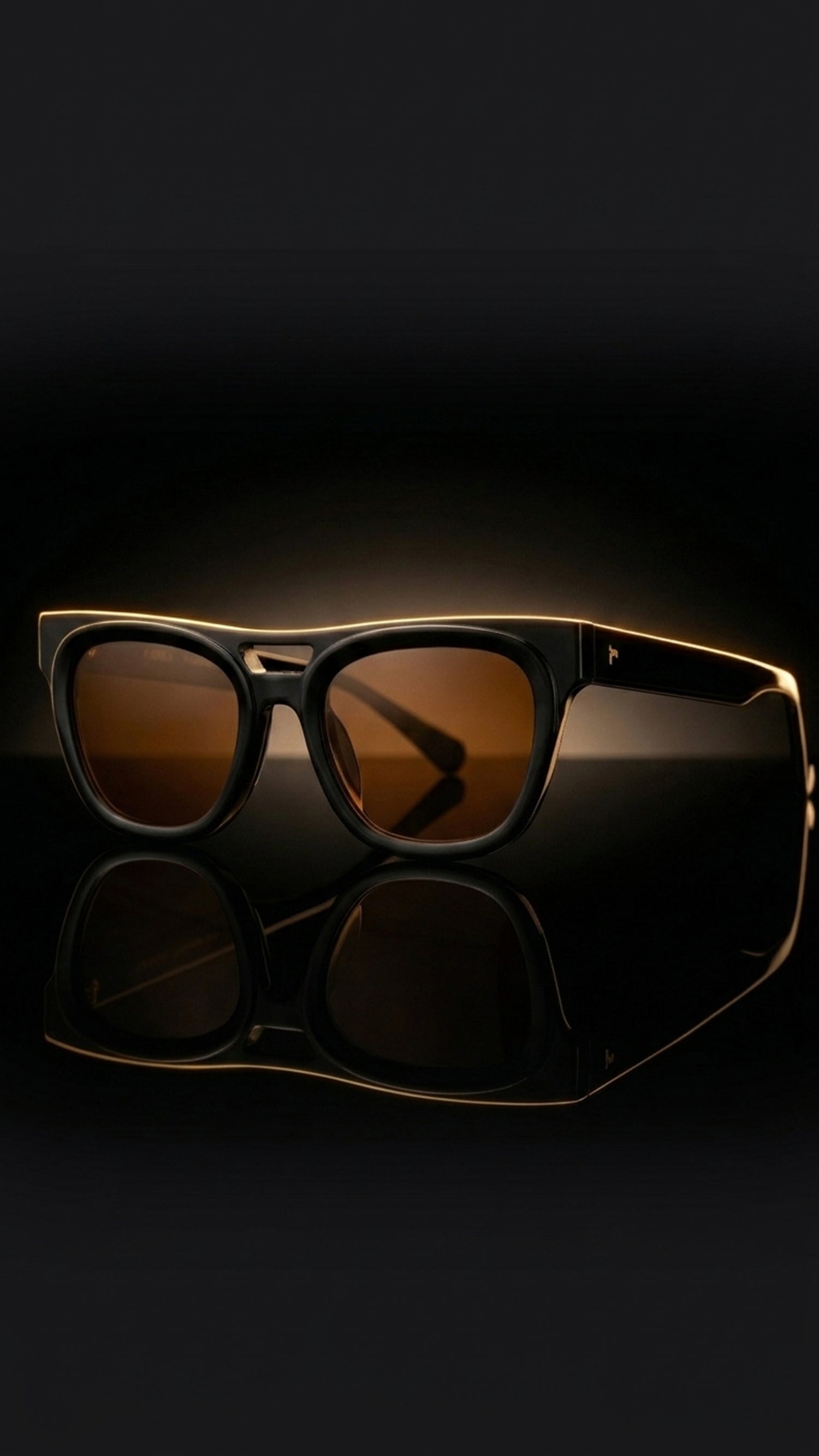 AARKA Peony polarized square sunglasses with black frame and brown tinted lenses.
