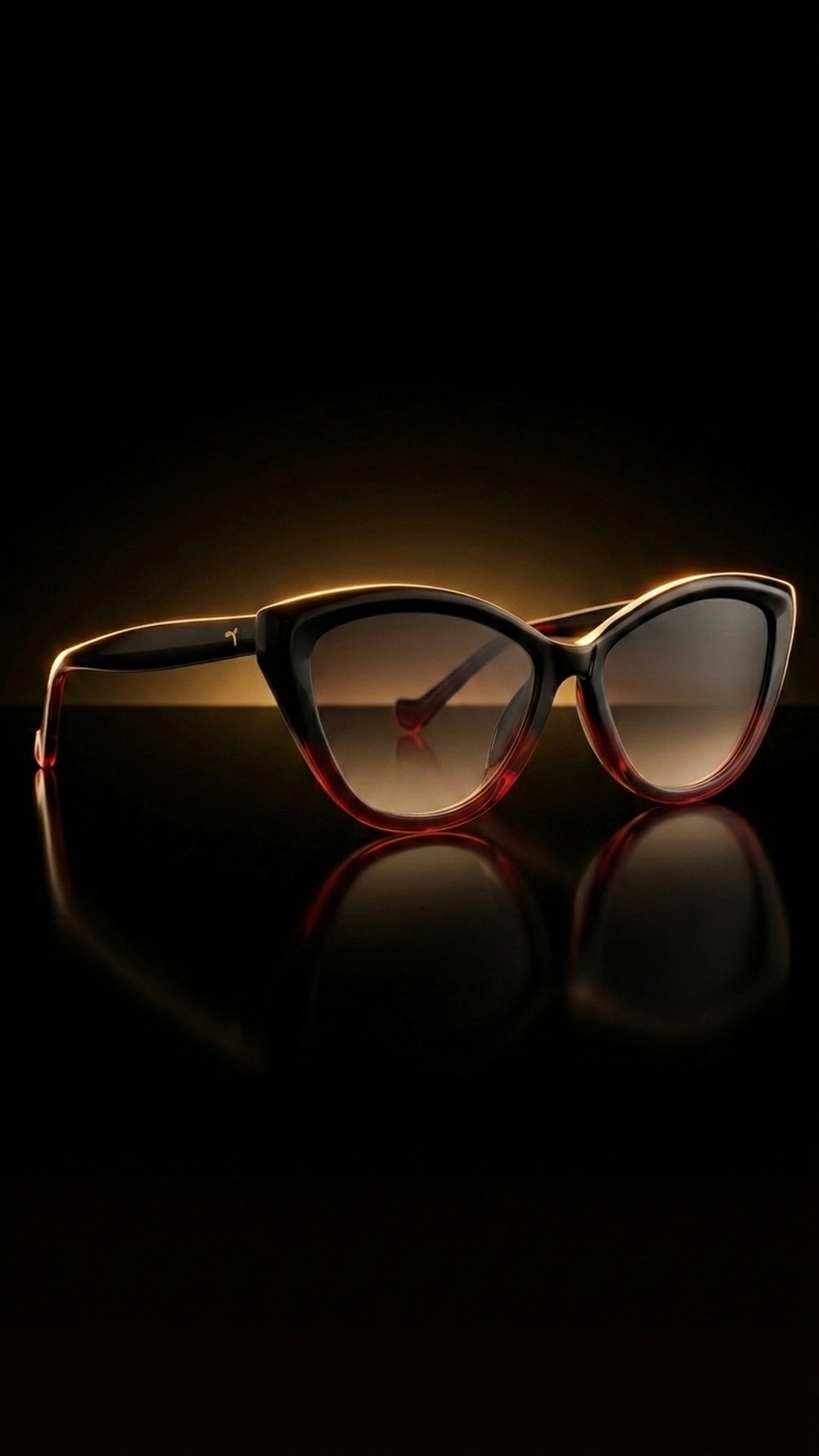 AARKA Rosea polarized cat-eye sunglasses with black and red gradient frame and smoke lenses.
