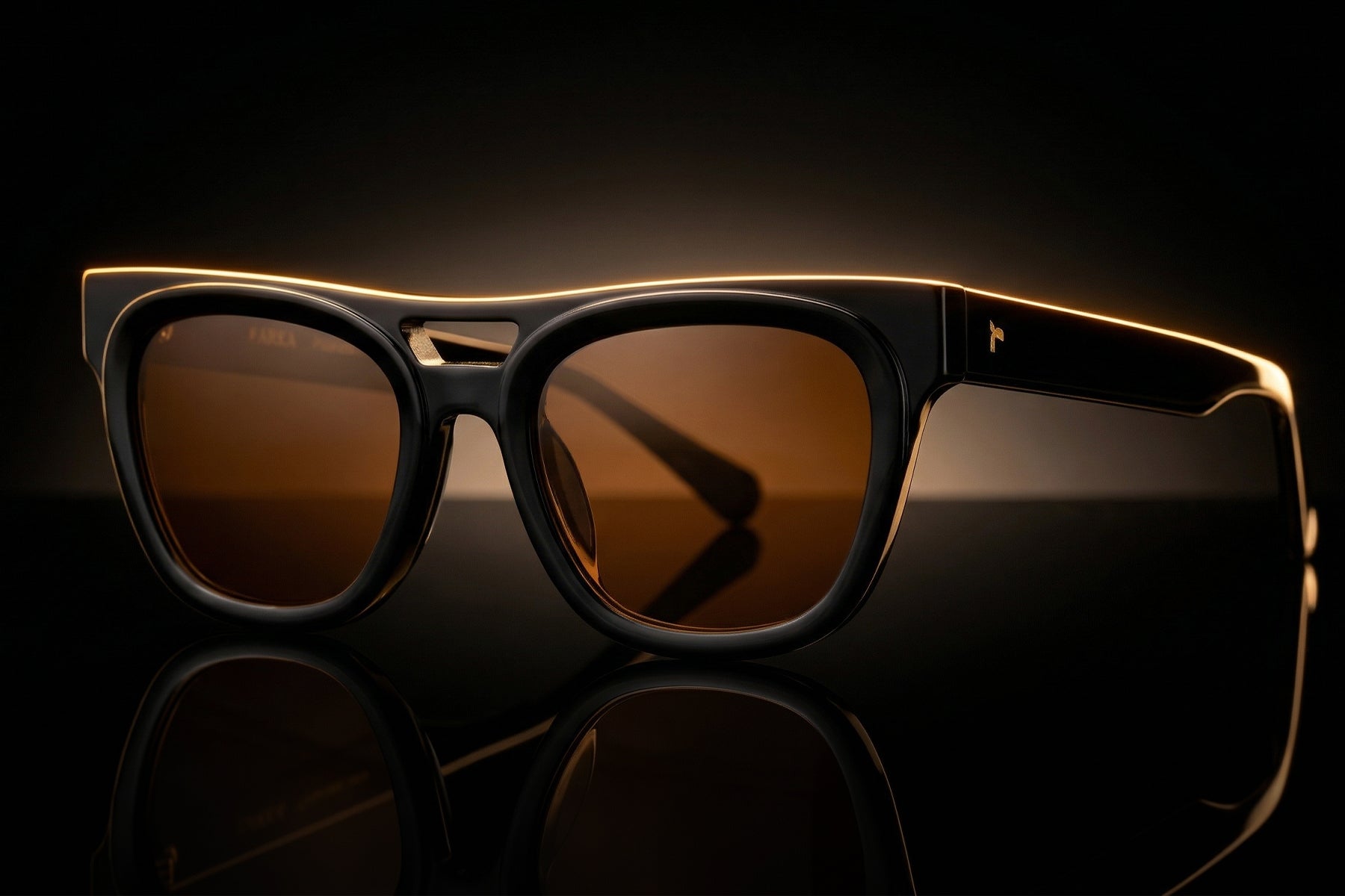 AARKA Peony polarized square sunglasses featuring a glossy black frame with brown tinted lenses, displayed in an angled studio view.